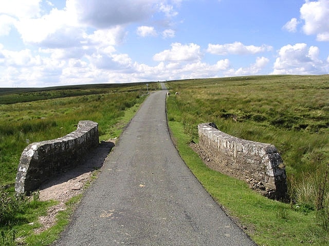 Moorland road This unclassified hill road from Newcastleton to Langholm is single lane with passing places. The bridge in the foreground spans a small burn at Black Sike.