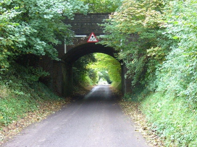 Road goes under disused railway bridge near Cocking The road approaches Cocking from Bepton and the railway used to run between Chichester and Midhurst. The former Cocking station is now a private residence and is out of sight to the right.