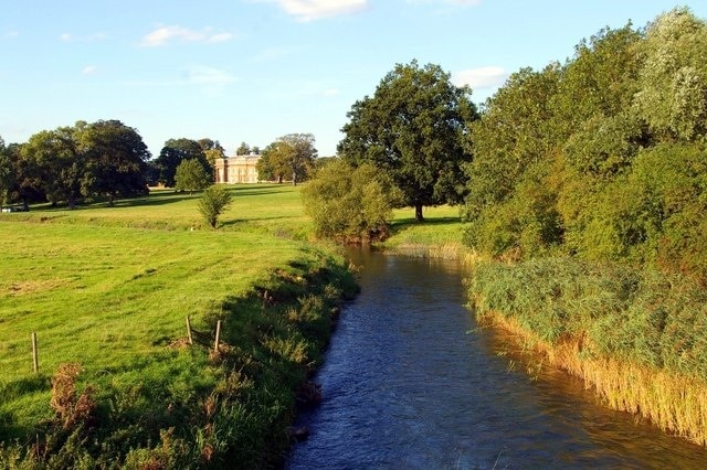 Turvey House View of the house, built in 1794, amid its lush parkland from the bridge over the Great Ouse.