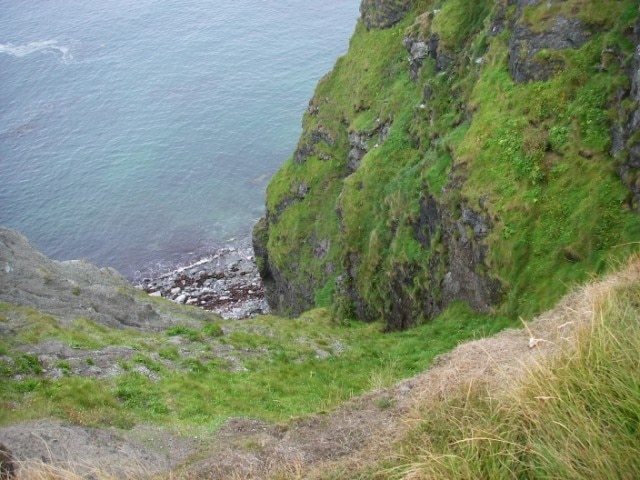 View down cliff at Neap of Norby The crumbling cliffs are composed of a mix of schists and gneisses.