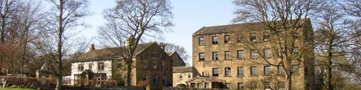 Photo "Barker Royde Farm, Southowram Evidently a mill built next to a farm, but strangely not named as a mill on the old OS maps. It was built around 1849 to the order of William Barber, grandfather of architect William Swinden Barber and used as a mill for manufacturing carding equipment. It was later used as a store for Marshall's Quarry. It was bought by the owner of the farm in the 1970s and used for storage. It is now apartments." by Humphrey Bolton (Creative Commons Attribution-Share Alike 2.0) / Cropped from original