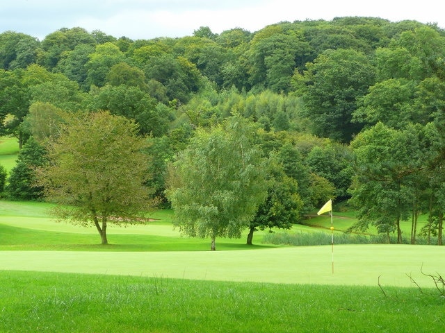 Fifth and seventh greens View of the Rolls of Monmouth Golf Course from the public road near Middle Hendre. The course is a former heavily-wooded deerpark.