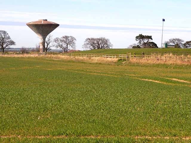 Water tower and reservoir This remarkable water tower, looking like a magic mushroom, or possibly a hooded cobra, together with a covered reservoir stands on a slight rise near Morwick Farm, outside Warksworth.