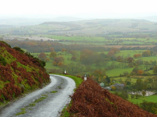 Lane steeply climbing the western flank of Long Mynd from Asterton, visible below right, in the civil parish of Myndtown, Shropshire, England.