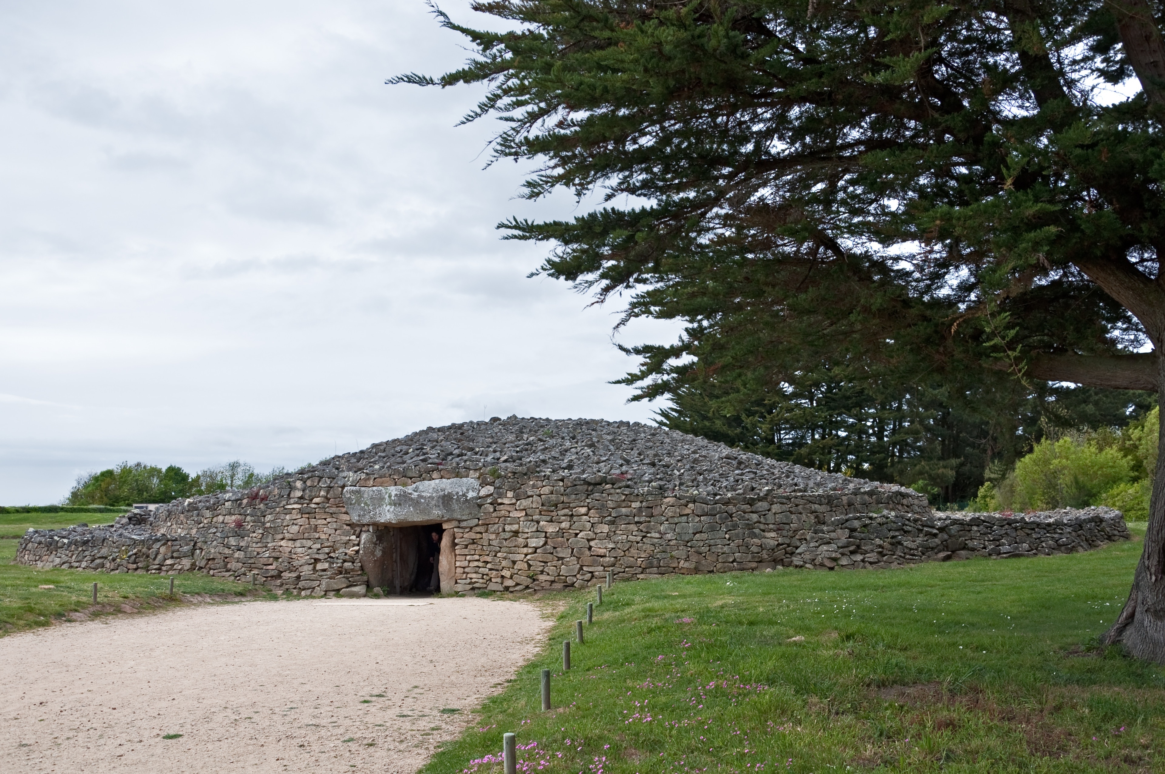 The restored cairn of the dolmen called 'La Table des Marchand' in Locmariaquer (Morbihan, Brittany, France)