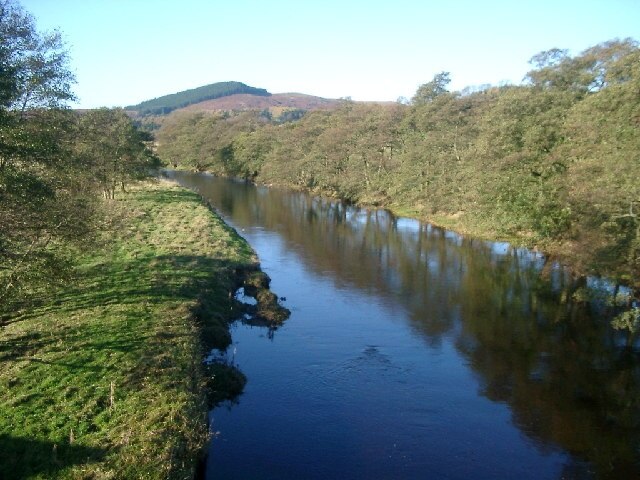 Upstream on River Coquet from Hepple bridge. Harehaugh Hill in the background