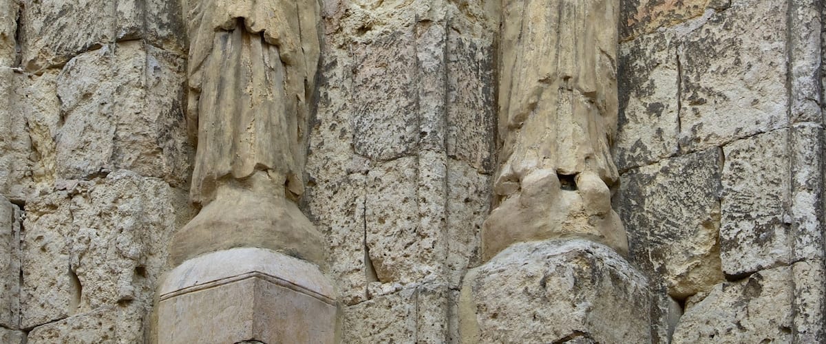 The romanesque statues, left of entrance of Church San Martin, Segovia, Spain.