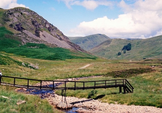 Footbridge in Glen Isla Wooden footbridge in a rather decayed state. Not the safest way to cross the River Isla.