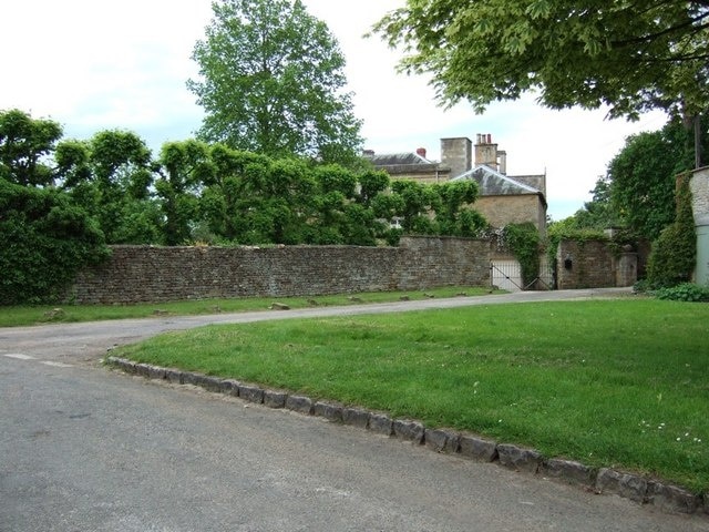 Oddington House, Lower Oddington. Both Upper and Lower Oddington have some particularly fine houses. This one hidden behind Cotswold stone walls is Oddington House itself, presumably the grandest property in the village.