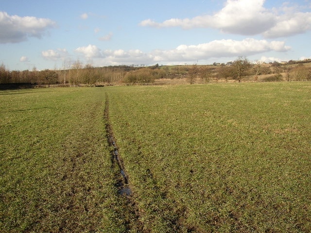 Footpath through former Three Nuns Colliery, Hartshead, Yorkshire. This field was a coal mine, with shafts, spoil heaps and a mineral railway that was part of a network stretching from Brighouse to Low Moor (Bradford).