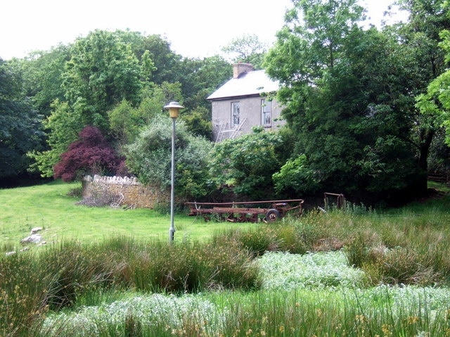 Brimaston Hall Old gentry house associated with the Devonald and Morse families which now seems a little run-down and the pond in the foreground is completely overgrown. The street light seems an odd touch in such a profoundly rural spot.