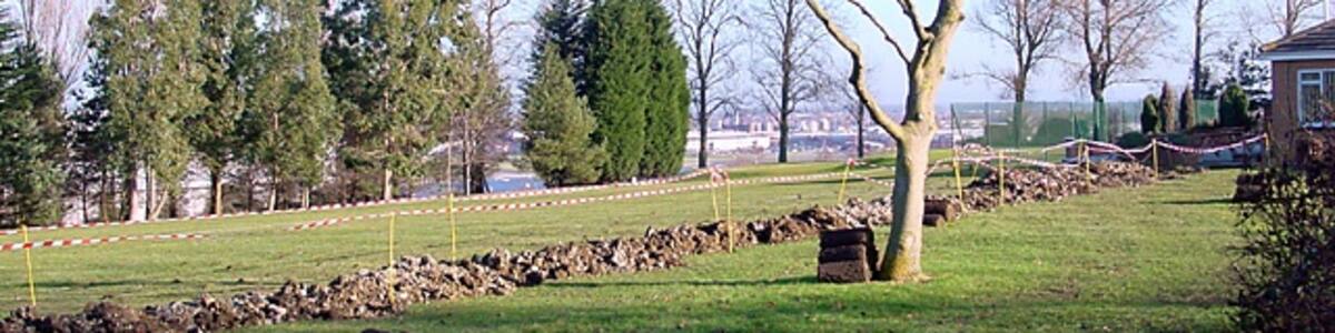 Photo "Filton Golf Course. The view through the trees is down to the air-field and surrounding industrial buildings down in the valley." by Linda Bailey (Creative Commons Attribution-Share Alike 2.0) / Cropped from original