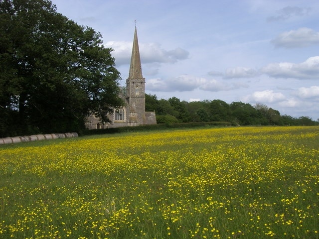 View northeast across a field at Midgham, Berkshire to St Matthew's parish church