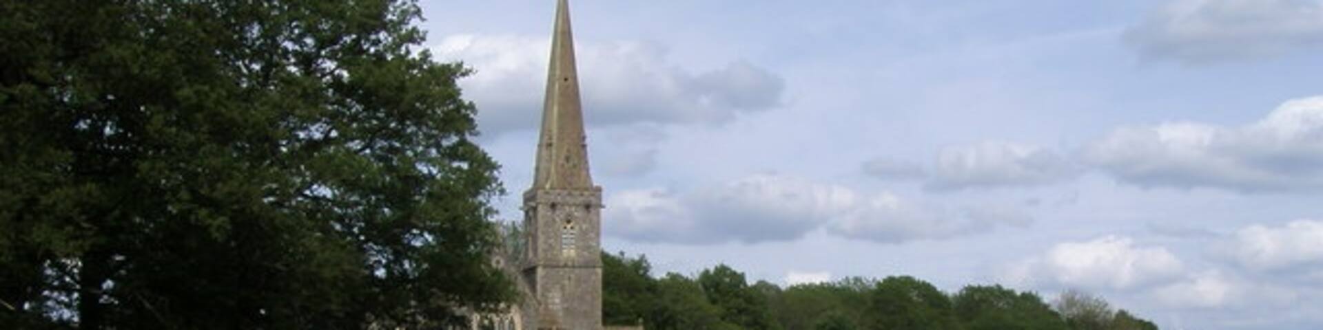 View northeast across a field at Midgham, Berkshire to St Matthew's parish church