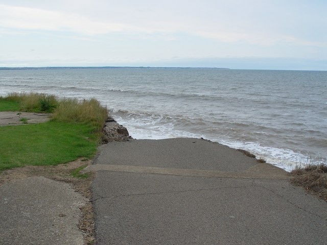 The End of the Road, Ulrome, East Riding of Yorkshire, England. The line where the sky meets the sea is also marked by the (just visible) cliffs of Flamborough Head.