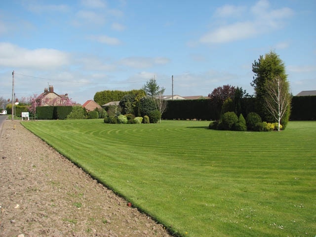 A fine lawn It is located beside the old Outwell Road.