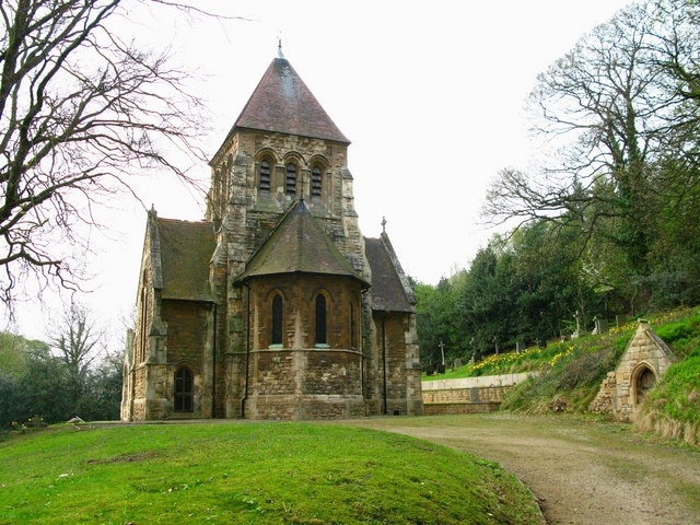 St John's Church The building was erected in 1874, but looks much older. A doorway into the hillside in the graveyard adds "character" to the Church.