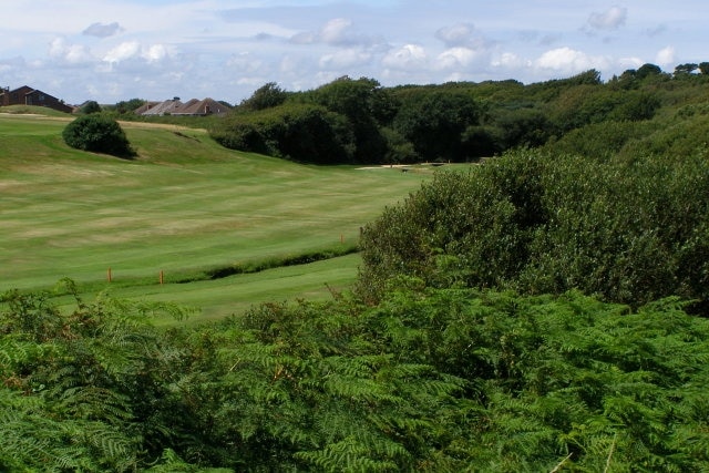 Barton on Sea golf course Looking down on a small part of Barton on Sea golf course from a public footpath to Beacon Cliff from Barton Common. The trench in the valley (marked by pairs of red posts) is Becton Bunny, which reaches the beach via a small chine to the south-east of here. The bungalows with hipped roofs are on Willow Walk.