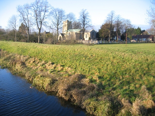 Tallington parish church, Lincs. Dedicated to St Lawrence; the tower is 14th C and the nave arcades and transepts are primarily 13th C http://www.crsbi.ac.uk/ed/li/talli/ . View NW from the bridge over the Maxey Cut.