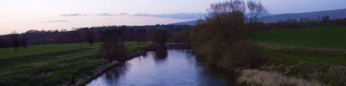 Photo "River Eden Viewed from the A66 at Eden Bridge." by Andrew Smith (Creative Commons Attribution-Share Alike 2.0) / Cropped from original