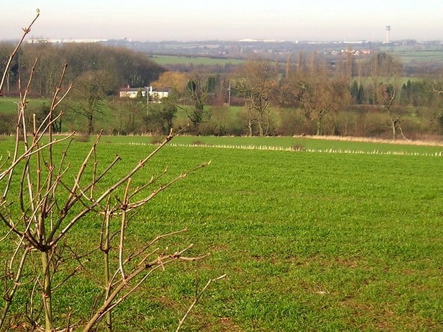 Rolling pasture off Dry Pot Lane near Long Whatton A robin was singing as I took this photograph on a bright February afternoon. The pasture slopes down to West Meadow Brook, while in the distance East Midlands Airport dominates the horizon.