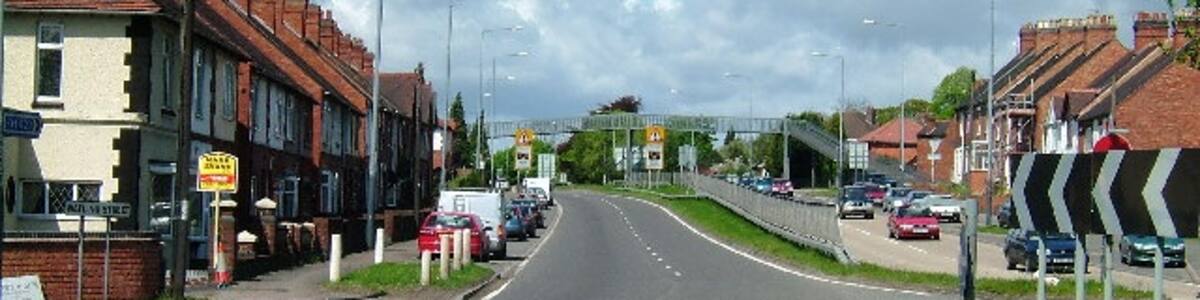 Photo "Dordon on the A5. This is the busy A5 looking towards Tamworth." by Andy and Hilary (Creative Commons Attribution-Share Alike 2.0) / Cropped from original