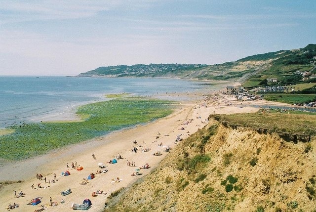 Charmouth beach  and Lyme view The town of Lyme Regis is in the distance.