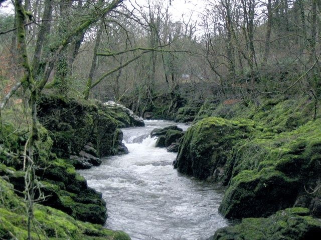 Waterfall on Afon Sawdde This is the river Sawdde flowing north towards Llangadog. At this point there are roads either side of it: a minor one on the left bank; and the A4069 to Brynaman on the right. The whole length of the riverbank here is composed of upended strata of rock. You can drive past thousands of years of geology without even realising it.