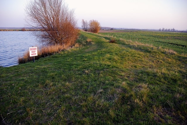 Small lake, Yaxley This small lake has been created by a large embankment. There were a number of ducks on it and the area is shown as a Nature Conservation Area.