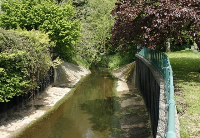 River Boyd looking upstream From the bridge carrying the A431 at Bitton. At one time the river carried raw effluent from the area into the River Avon just over half a mile to the south. Much cleaner now its condition then can hardly be imagined.