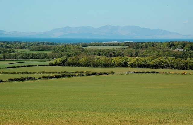 Farmland View At Low Wardneuk A fine view of Kyle's rich farmland, looking towards Troon and the island of Arran. Viewed in early May.