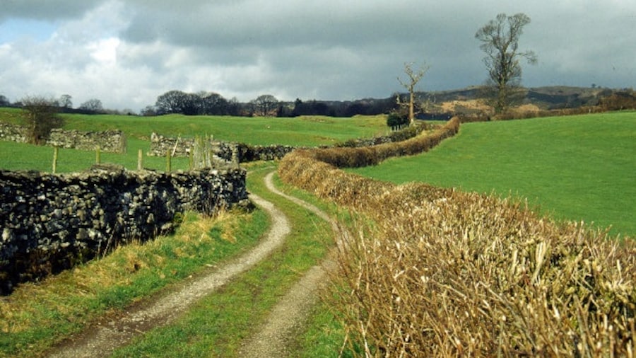 Photo "Track leading towards Crosthwaite. This track leads from an old water mill (now a conference and training centre) towards Crosthwaite village." by Stephen McKay (Creative Commons Attribution-Share Alike 2.0) / Cropped from original