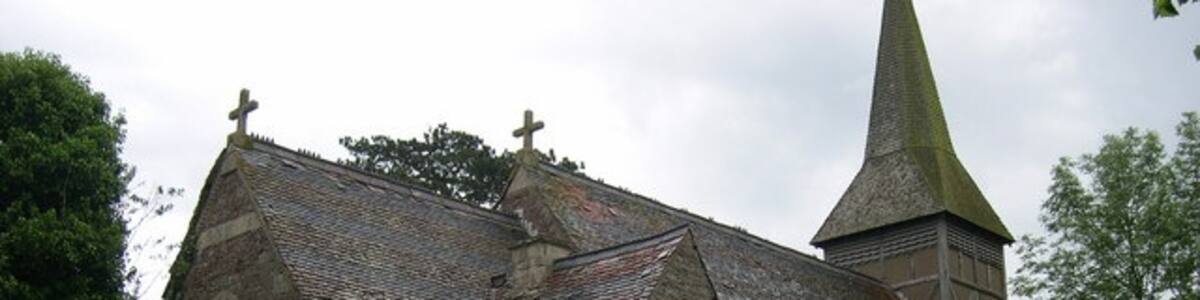 Photo "The former parish church of St Andrew, Wolferlow, Herefordshire, seen from the northeast. When this photo was taken the building was closed, had holes in its roof and was for sale." by Philip Pankhurst (Creative Commons Attribution-Share Alike 2.0) / Cropped from original