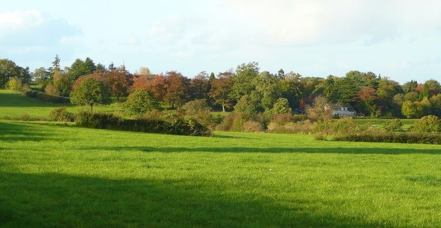 Pasture and woodland View north-west of Gorsty Hill.