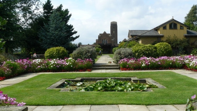 Croydon Crematorium, Croydon Cemetery Looking across the garden of remembrance, towards the two chapels. The older chapel is in the centre of picture, the newer one to the right of centre. There must be a gardener lurking somewhere, since two plants appear to be awaiting planting. http://en.wikipedia.org/wiki/Croydon_Cemetery