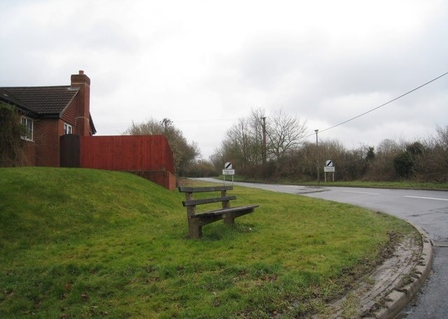 Village bench On the corner of Winchester Street and Sapley Lane.