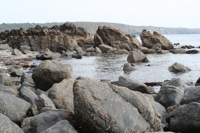 Rocky foreshore north of Polbream Point Seen on a low spring tide on a bright Autumn day.