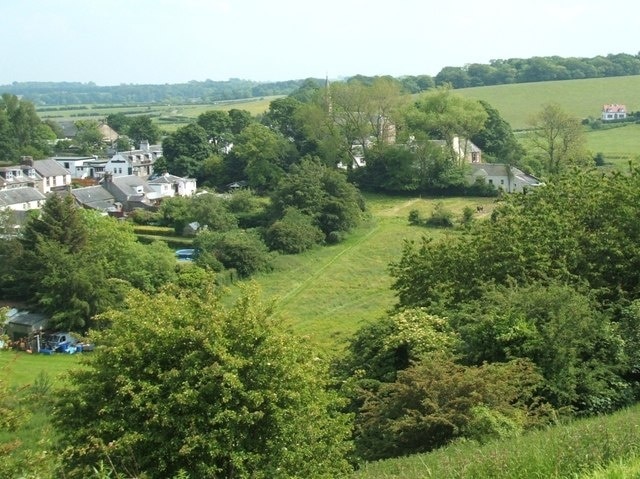 Looking East towards the Church A view of the back gardens of Main Street towards the partially obscured church. At least one horse has free rein over the field in centre. Photo taken from castle hill.