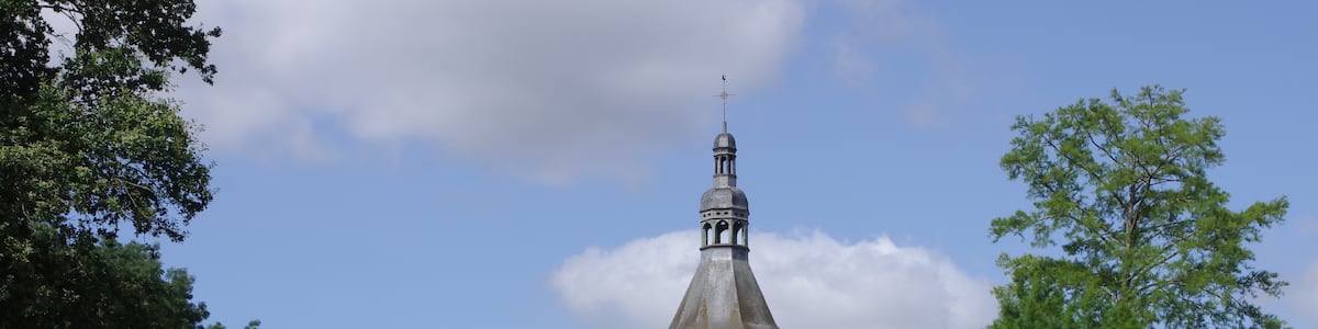 Photo "Trees and bell-tower of church Saint-Nicolas de Civray, France." by JLPC (Creative Commons Attribution-Share Alike 3.0) / Cropped from original
