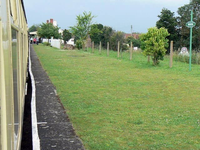 Washford WSR station, Washford Looking north-east along an unusually wide platform laid to grass. The shot was taken from near the front of the train to Minehead at the end of the line to the west three more station stops away.