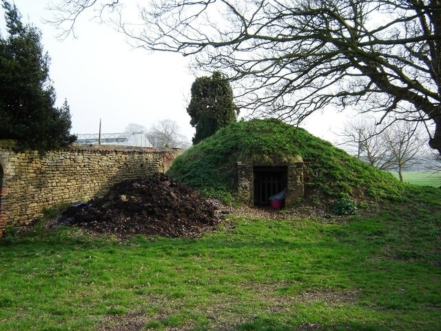 Old Ice House Hotham Hall, Hotham, East Riding of Yorkshire, England. The wall to the left is the walled garden for the Hall. The footpath runs past the Ice House across The Park to North Cave.