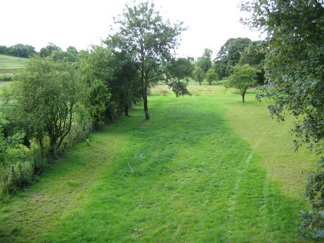 The former Midland and South Western Junction Railway (M&SWJR) extended their main line from Swindon to Andover through Collingbourne Kingston along this route in 1891. However it was not until 1932 that the halt here was built and a photograph available elsewhere on the internet shows that it was nothing more than a couple of short wooden platforms each with a rudimentary corrugated metal hut as a waiting room. The train service was odd to say the least, with a 1953 timetable showing 3 trains leaving northbound for Swindon at 8.18 am, 3.01 pm and 6.07 pm, with the first and the last continuing the full length of the M&SWJR to Cheltenham, while there were 4 trains leaving southbound for Andover at 8.41 am, 4.11 pm, 5.40 pm and 7.57 pm. However the timetable did show the through timings to get from Collingbourne Kingston to Newcastle-upon-Tyne if you so desired (arriving at 6.29 pm if you caught the 8.18 am or 4.22 am if you caught the 6.07 pm...) The whole line was closed in September 1961, just a couple of months after Doctor Richard Beeching became Chairman of the British Railways Board. So the railway was already out of use by the time that Beeching's first report announcing wholesale closures of the railway network was published in 1963.