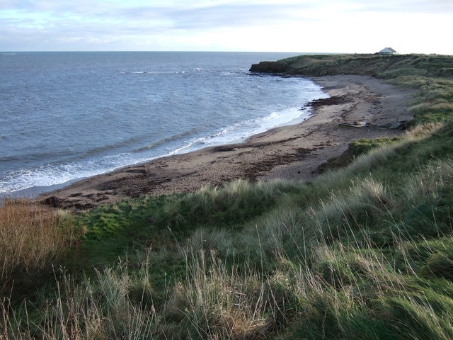 Wellhaugh Point A low rocky headland jutting out from Amble Links.