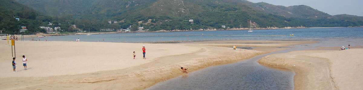 Photo "Silvermine Bay Beach at Mui Wo, Lantau Island" by edwin.11 (Creative Commons Attribution 2.0) / Cropped from original