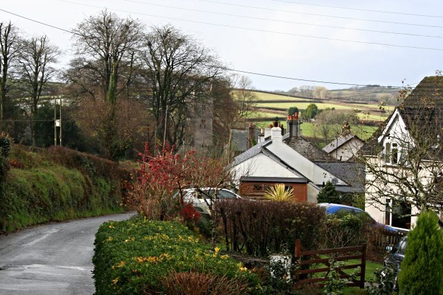 St Dominick Village Looking down the main village road towards the church in the adjacent grid square SX3967.