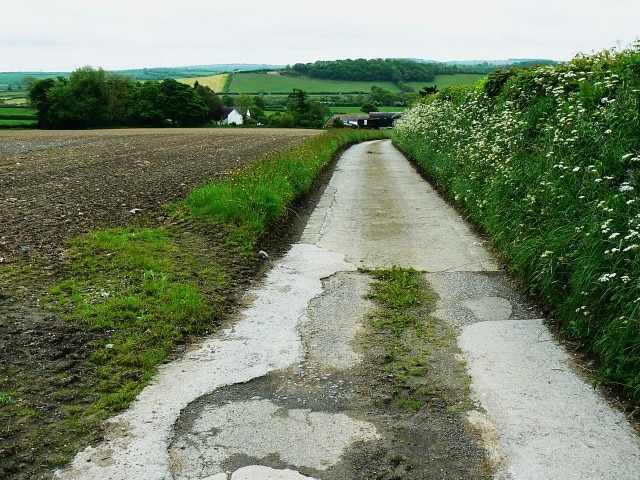 Track to Bwlchydomen, near St Clears The track also serves as a public right of way in the form of a footpath. The viewpoint is just off the old A40, now superseded by a new one. We are about 2 kilometres west of St Clears which, if it's famous for anything, ought to be for being the most westernmost part of south-west Wales it's possible to reach from Europe using only motorways and dual carriageways. The furthest west to meet that criterion in all of Wales is probably Holyhead.