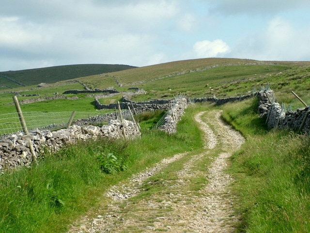 Pennine Way near Horton-in-Ribblesdale The Pennine Way climbs steadily upwards towards Birkwith Moor along a track lined by dry stone walls.