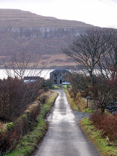 The road to Stein The road ends in Stein village a little way beyond the corner in the photograph. The water is Loch Dunvegan with the cliffs of Sgurr a'Bhàgh in the background.