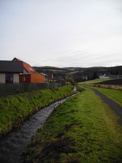 Ballo Burn Hill of Gattaway in the background Ballo Burn by new housing development.