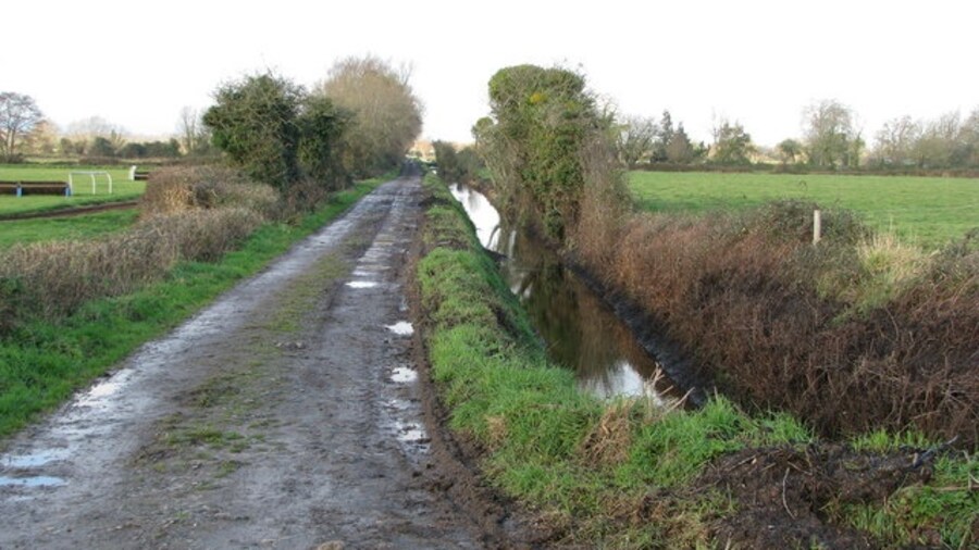 Photo "Drainage channel parallels farm track" by Sarah Charlesworth (Creative Commons Attribution-Share Alike 2.0) / Cropped from original